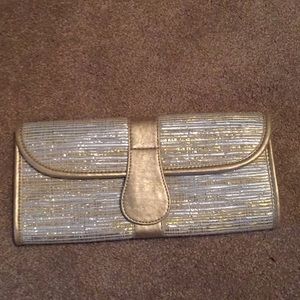 Gold and silver straw clutch